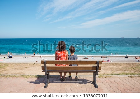 Stock photo: Mom And Child Walking Along Waterfront