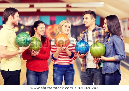 Stockfoto: Bowler Bowling At Group Of People