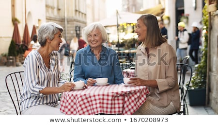 ストックフォト: Senior Woman Drinking Coffee At Street Cafe