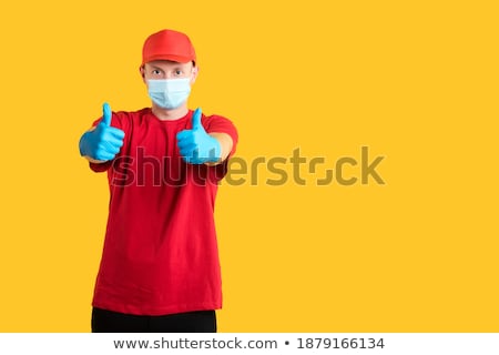 Stock foto: Delivery Man With Food And Drinks Showing Ok