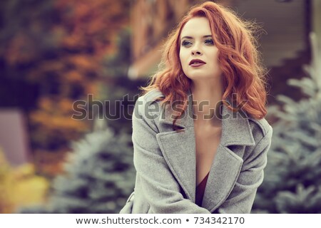 Stockfoto: Portrait Of Redhead Young Woman Looking At Sun