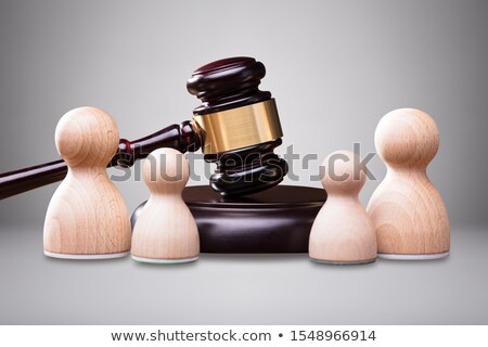 Stock fotó: Wooden Pawns In Front Of Gavel And Mallet