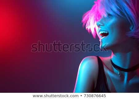 Stok fotoğraf: Beautiful Singer Over Abstract Background