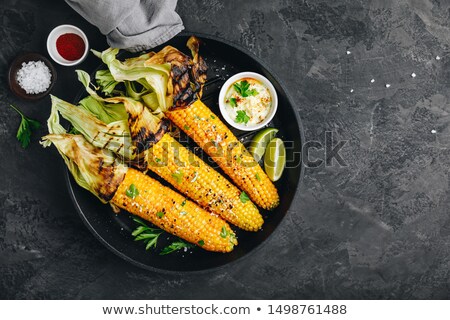 Zdjęcia stock: Corn Topped With Butter On The Grill