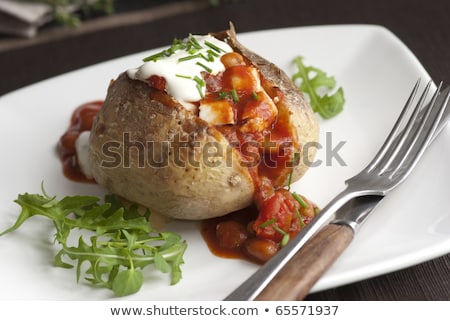 Stockfoto: Baked Jacket Potato With Sour Cream Sauce