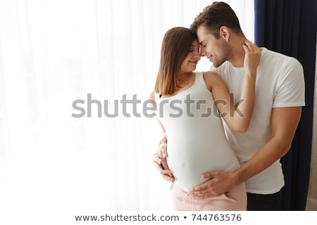 Stock photo: Waiting For Baby Happy Man Hugging His Pregnant Woman