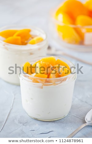 Yogurt With Poached Mango Foto stock © mpessaris