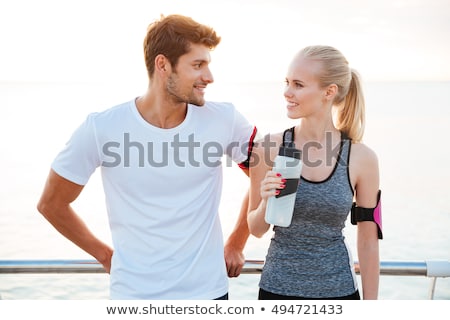 Foto d'archivio: Cheerful Young Strong Sports Man Walking Outdoors