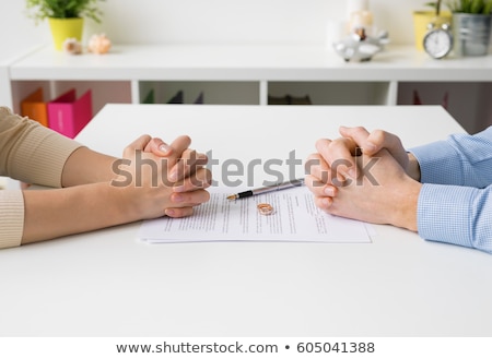 Stockfoto: Couple Hands On Divorce Agreement