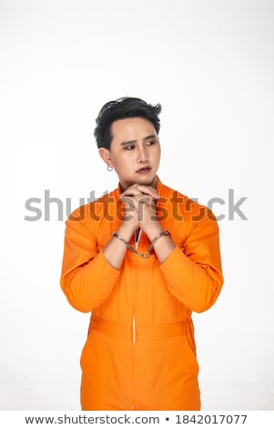 Foto stock: Young Inmate With Chains Isolated On The White