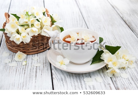 Cup Of Green Tea With Jasmine Flowers Isolated On White Foto stock © almaje