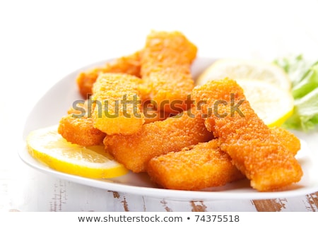 Fish Sticks With Lemon And Salad Foto d'archivio © chirapbogdan