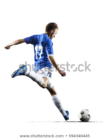 Stock fotó: A Soccer Player Kicking The Ball