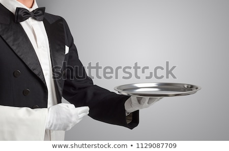 Foto stock: Servant White Glove Holds Stainless Steel Tray