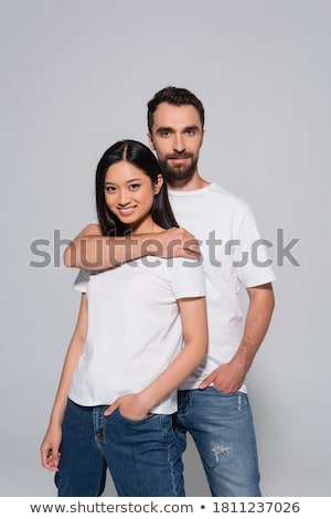 Stock photo: Two Beautiful Multicultural Young Women Hugging While Posing Cam