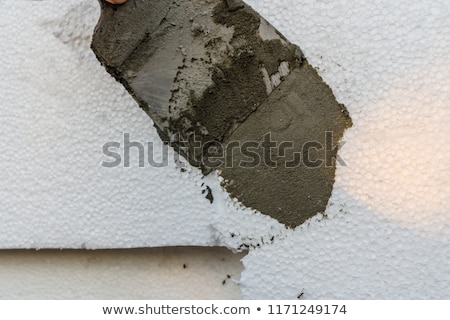 Stockfoto: Wall Insulation Spreading Mortar Over Styrofoam Polystyrene Co