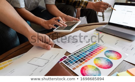 Stockfoto: Creative Team Analyzing Prototype Products For Product Design In
