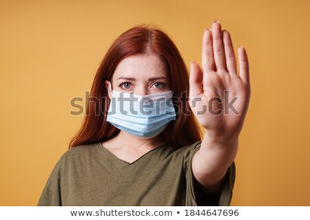 ストックフォト: Woman Making Coronavirus Pandemic Stop Gesture