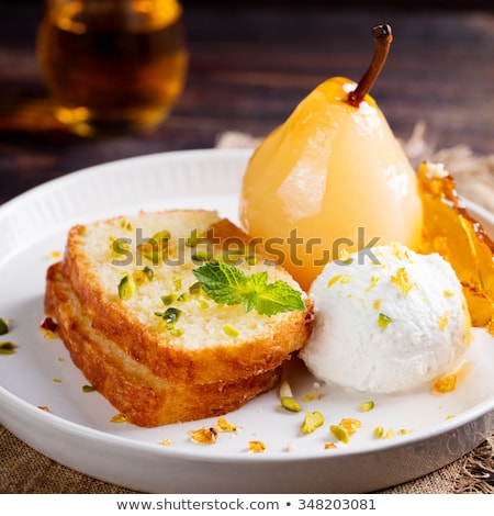 Zdjęcia stock: Brioche Cake With Poached In Wine Pear Caramel Croquant And Fresh Ricotta Cream In A White Plate O