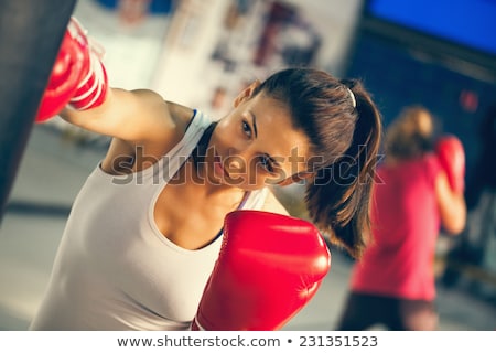 ストックフォト: Woman Boxing Exercise At Gym