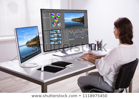 Stok fotoğraf: Editor Editing Video On Tablet