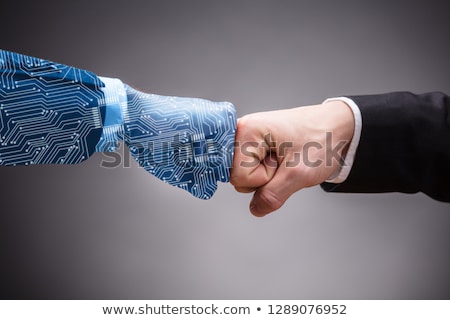 Stok fotoğraf: Robot And Businessmans Hand Making Fist Bump