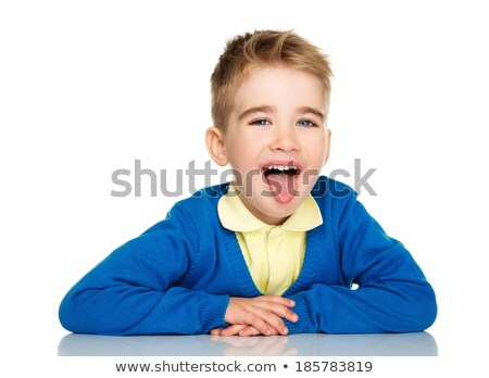 Stok fotoğraf: Sly Little Boy In Blue Cardigan And Yellow Shirt