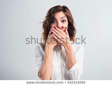 [[stock_photo]]: Young Woman Covering Her Mouth