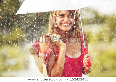 Stockfoto: The Portrait Of Young Beautiful Woman In The Rain