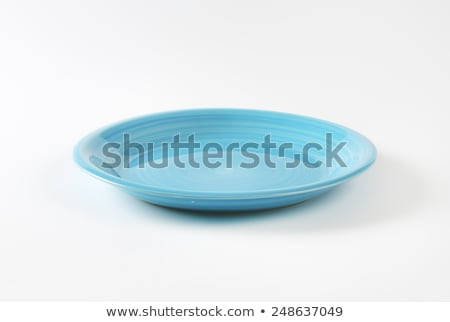 Foto stock: Rimless Round Blue Ceramic Plate