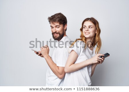 Stok fotoğraf: Man And Woman Standing Backs To Each Other