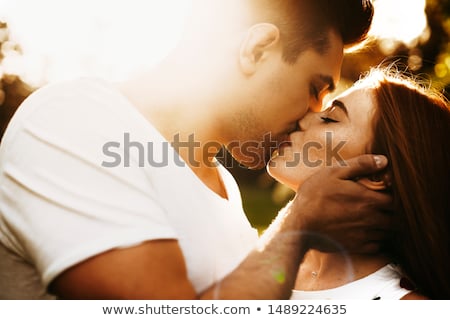 Stok fotoğraf: Close Up Of An Attractive Happy Couple In Love Kissing