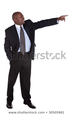 Foto stock: Vertical Image Of Smiling African Man Pointing Up