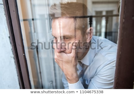 Сток-фото: Man Close To A Window Looking Sad