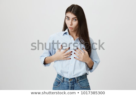 [[stock_photo]]: Emotional Brunette Woman Pushing Breast By Hands