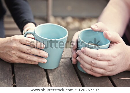 Сток-фото: Anonymous Woman Holding Mug Of Coffee