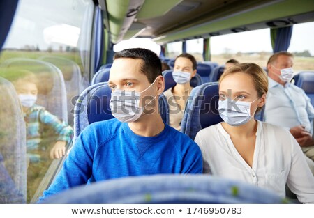 Foto stock: Young Man Traveling On A Tour Bus