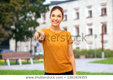 ストックフォト: Teenage Girl Pointing Finger At You Over Campus