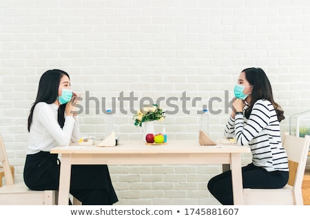 Stock photo: Asian Couple Eating Out At New Normal Restaurant