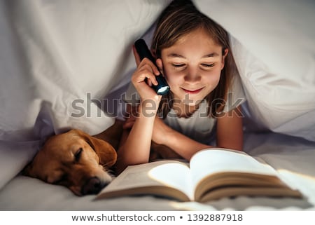 Foto stock: Teenage Girl Lying Down In Tent