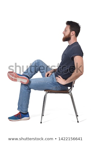 [[stock_photo]]: Side View Of Man Sitting On Chair