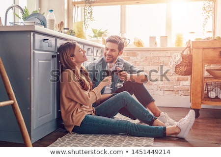 Foto stock: Young Couple Drinking Wine And Flirting