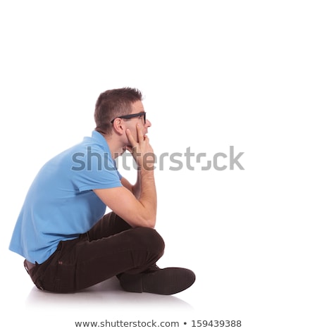 Zdjęcia stock: Side View Of A Seated Man With Cool Hair Style