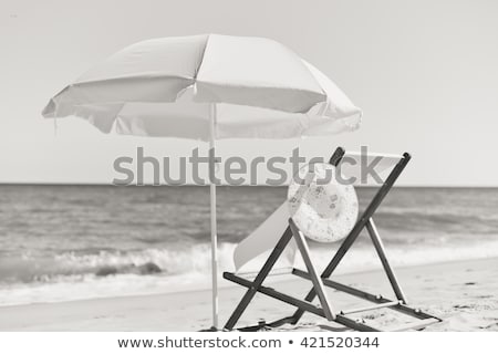 ストックフォト: Folded Deck Chairs At Sandy Beach At Seaside