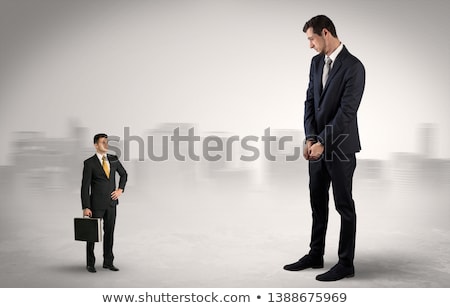 Foto stock: Giant Businessman Is Afraid Of Small Executor