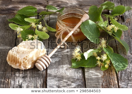 Foto stock: Fresh Sweet Honey Linden Flowers And Wooden Spoon