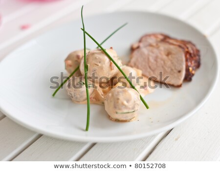 Stok fotoğraf: Potatoe Sallad With Some Meat In The Background