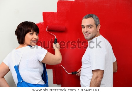 Zdjęcia stock: Couple Painting A Wall Red