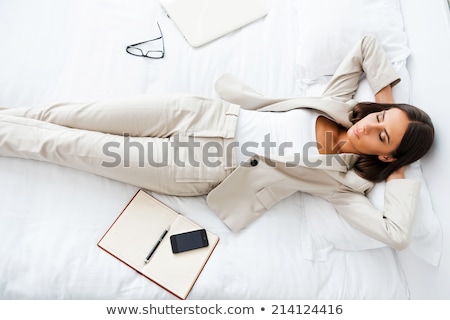 Stockfoto: Business Woman Resting On Bed