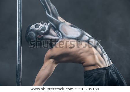 Zdjęcia stock: Male Pole Dancer With Body Art On Pylon